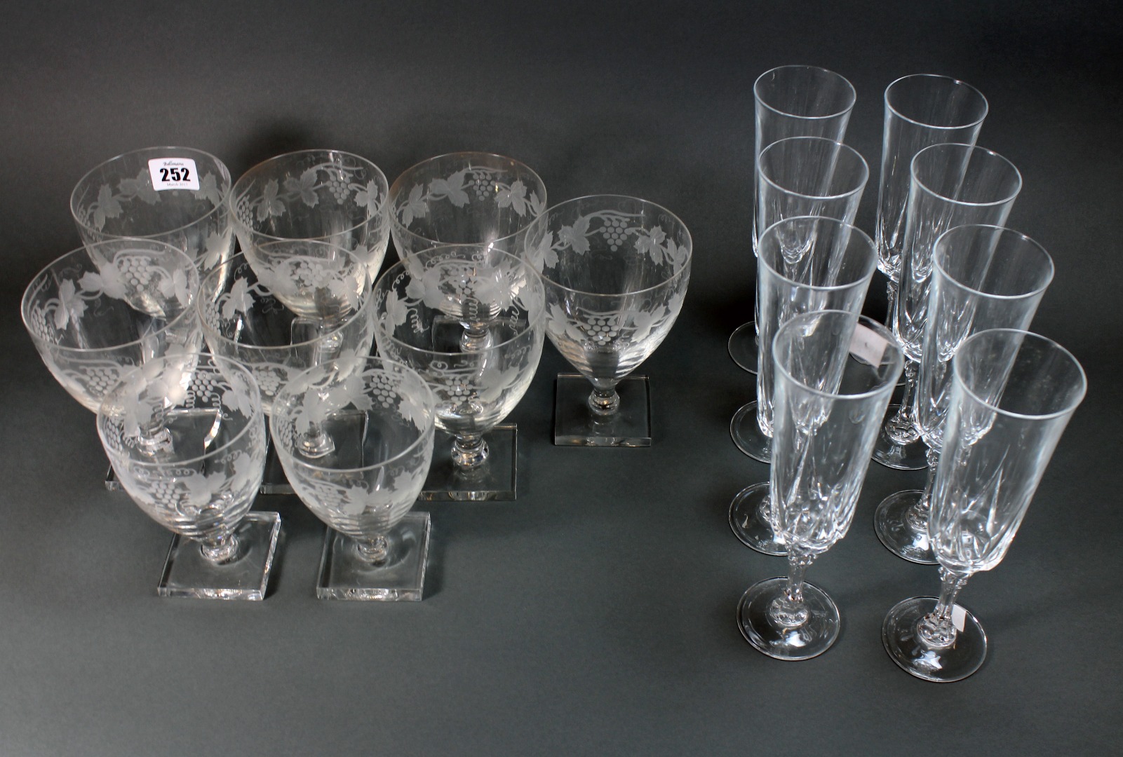 Appraisal: A set of nine fruiting vine etched glass rummers in