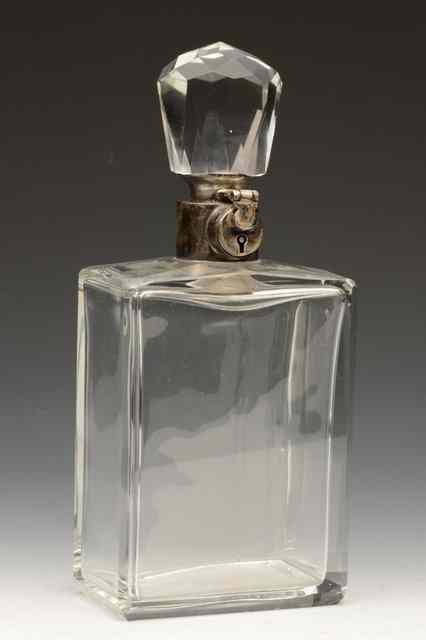 Appraisal: A 'S GLASS DECANTER with silver lock and band the