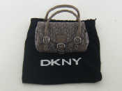 Appraisal: A DKNY fabric and leather clutch bag cm long with