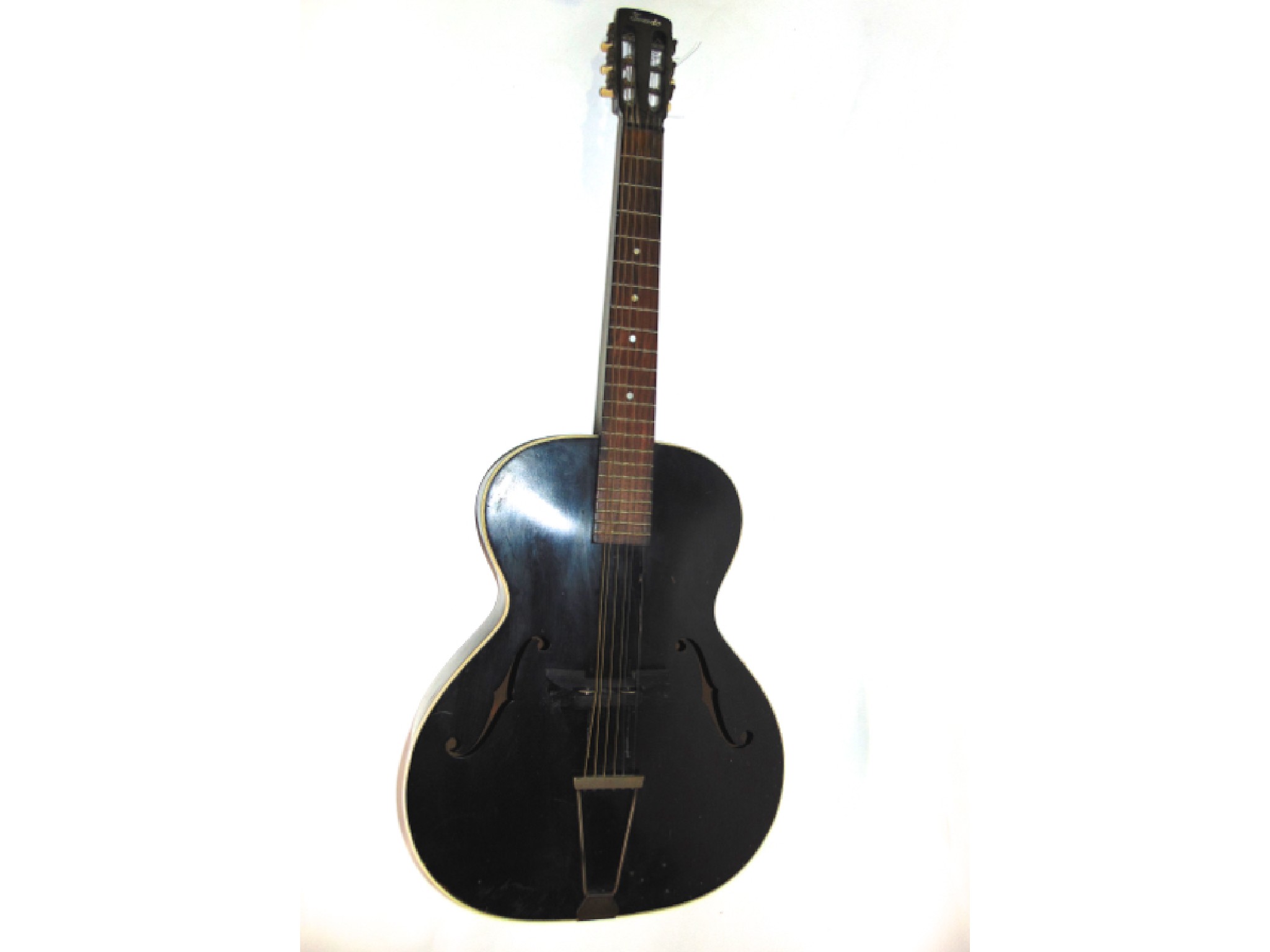 Appraisal: A cased vintage Tuxedo arch topped jazz guitar set within