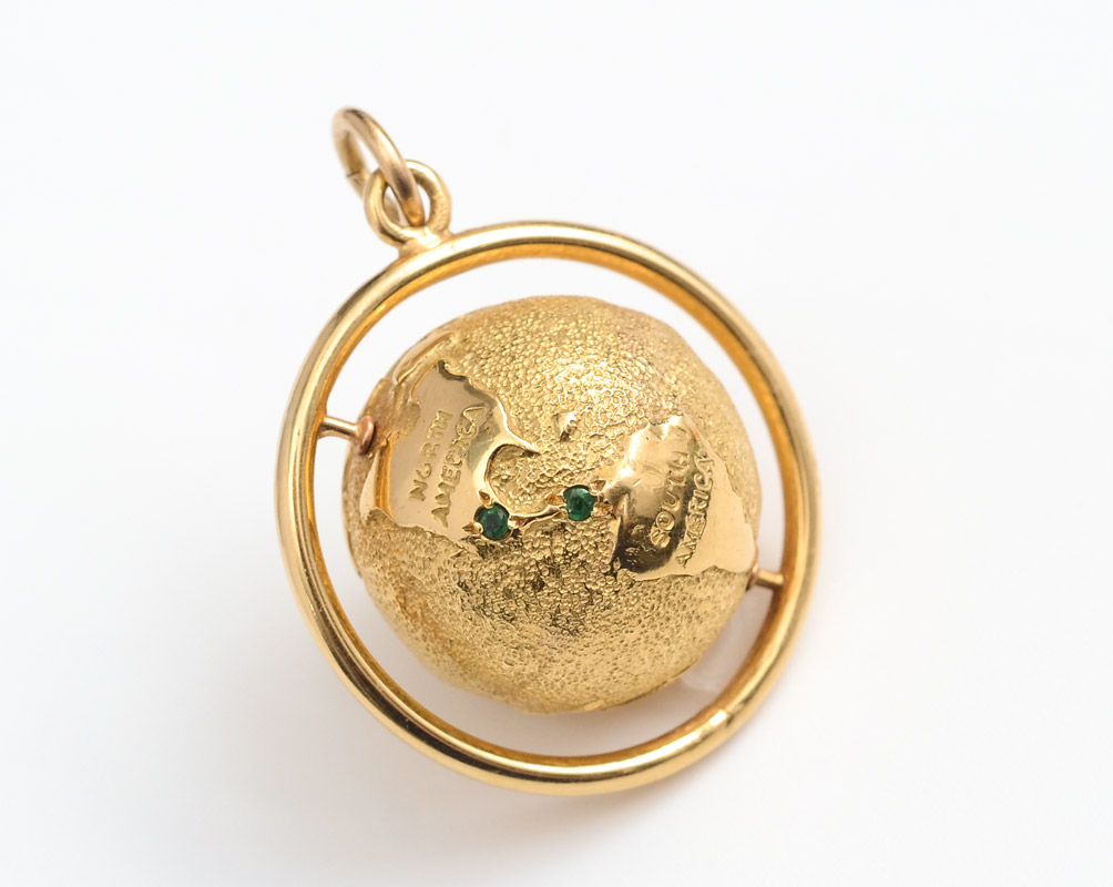 Appraisal: K SPINNING GLOBE CHARM K yellow gold spinning globe charm