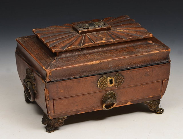 Appraisal: A GEORGE III LEATHER WORKBOX of sarcophagus form with gilt