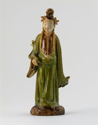 Appraisal: A Chinese pottery standing figure wearing flowing robes and holding