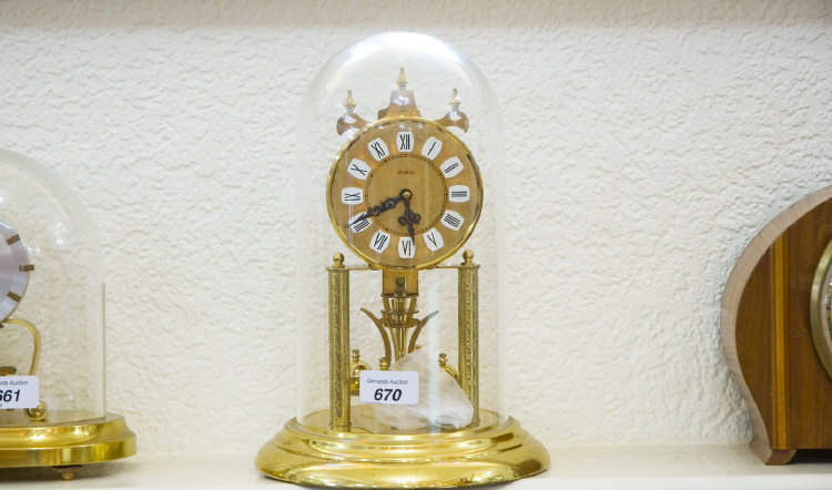 Appraisal: Anniversary Clock Glass Dome On A Brass Base German Movement