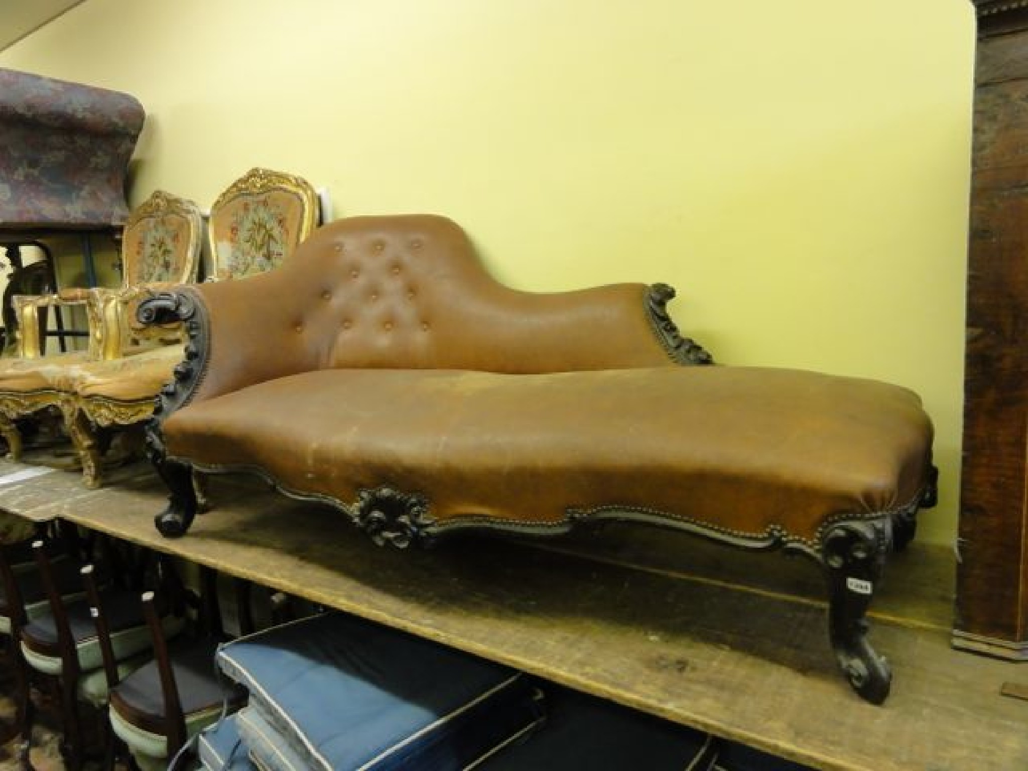 Appraisal: A substantial th century chaise longue with shaped outline upholstered