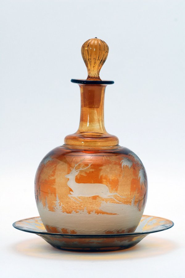 Appraisal: Bohemian amber decanter with underplate th century blown decanter with