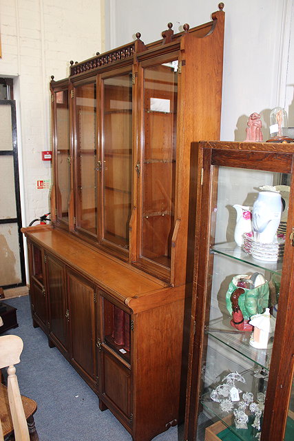 Appraisal: A VICTORIAN WALNUT LIBRARY BOOKCASE with turned finials and bobbin