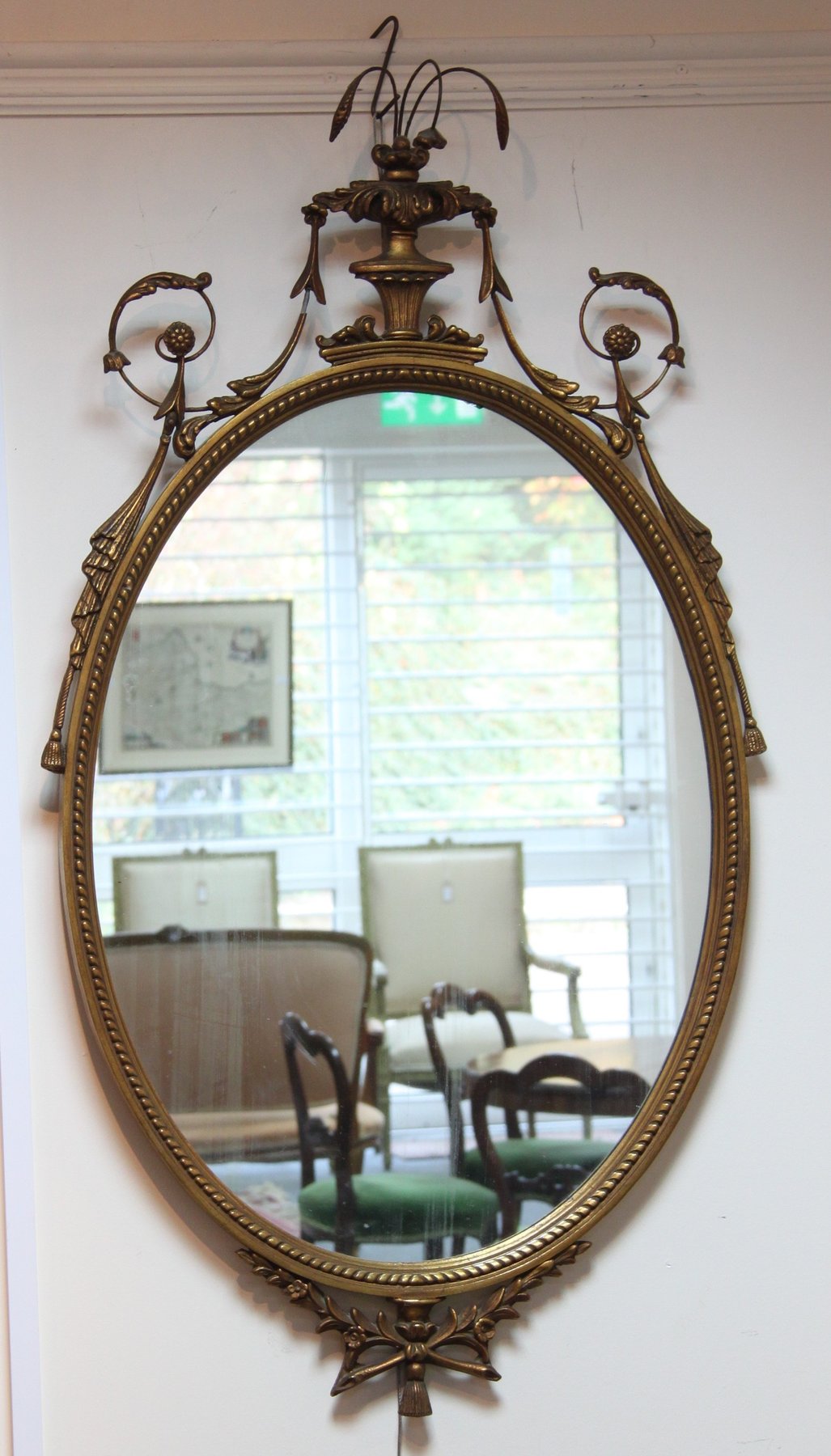 Appraisal: A pair of Regency style gilt framed mirrors with vase