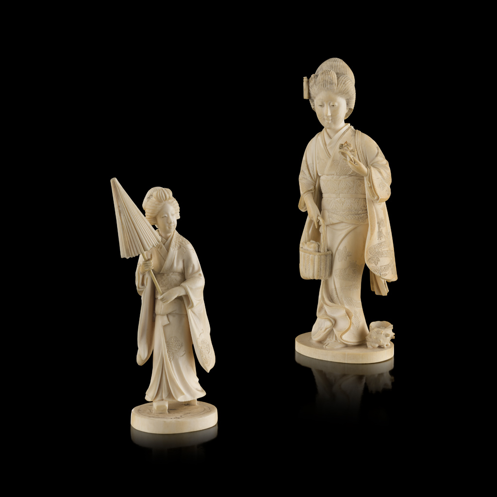 Appraisal: YTWO CARVED IVORY OKIMONO OF A BIJIN MEIJI PERIOD the