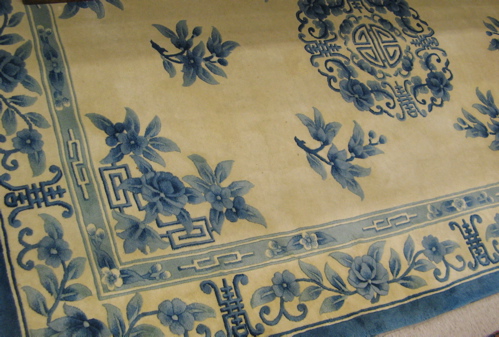 Appraisal: HAND KNOTTED CHINESE CARPET central medallion and scattered sprig decoration