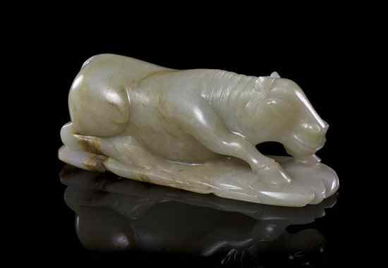 Appraisal: A White Jade Carving of a Recumbent Animal of white