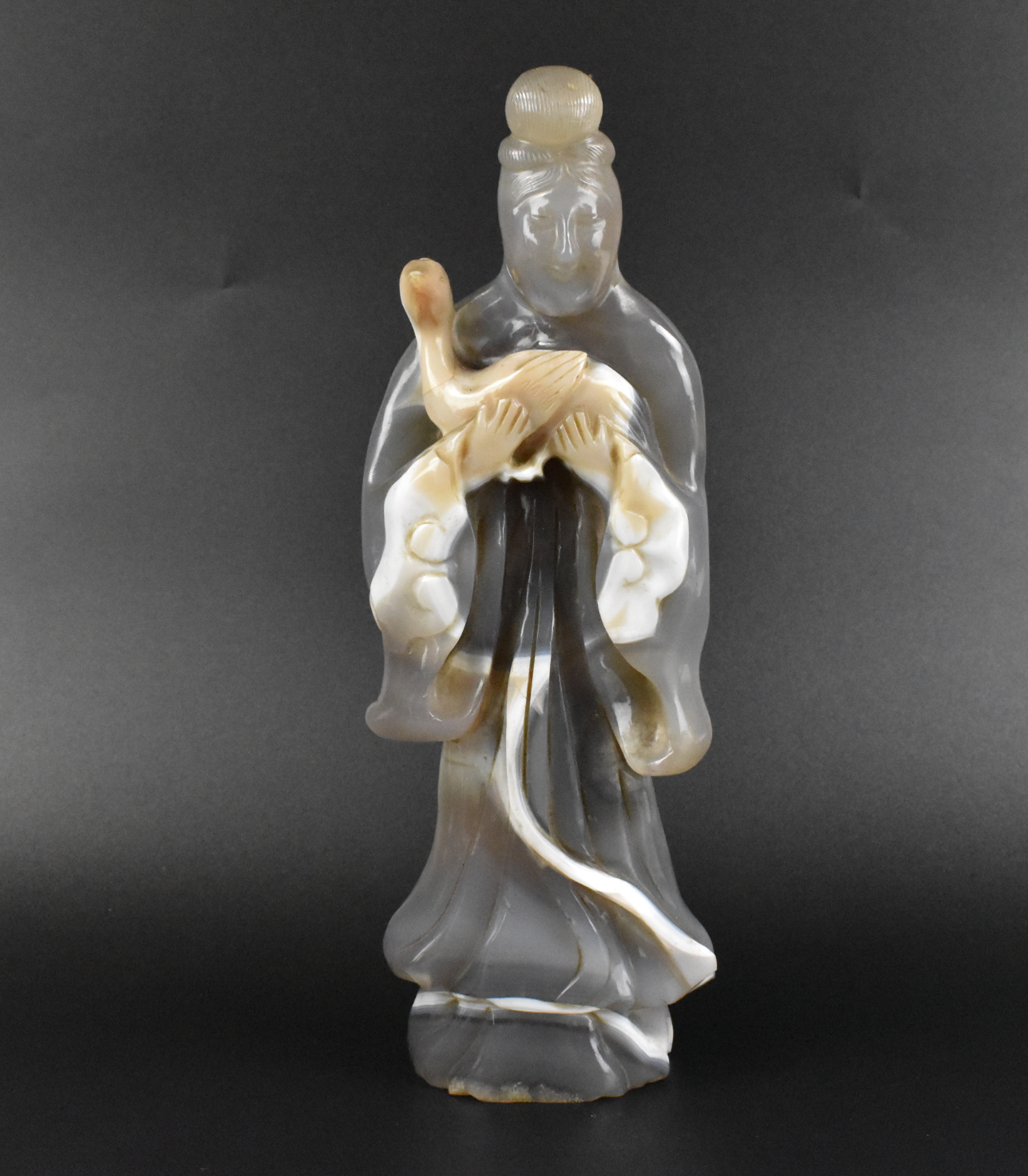 Appraisal: A Chinese agate carving of Guanyin with a goose dating