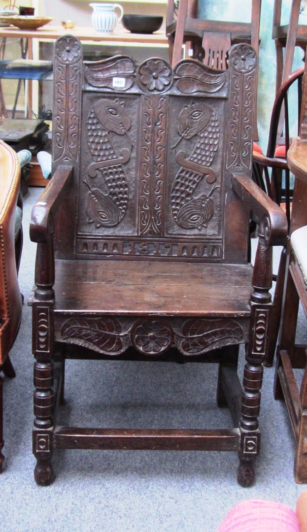 Appraisal: A th century and later carved oak armchair with dragon