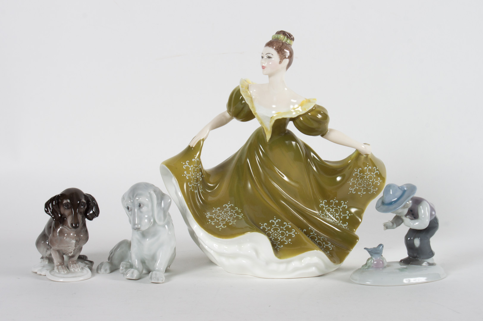 Appraisal: Three German figures and Royal Doulton figure Rosenthal porcelain dachshund