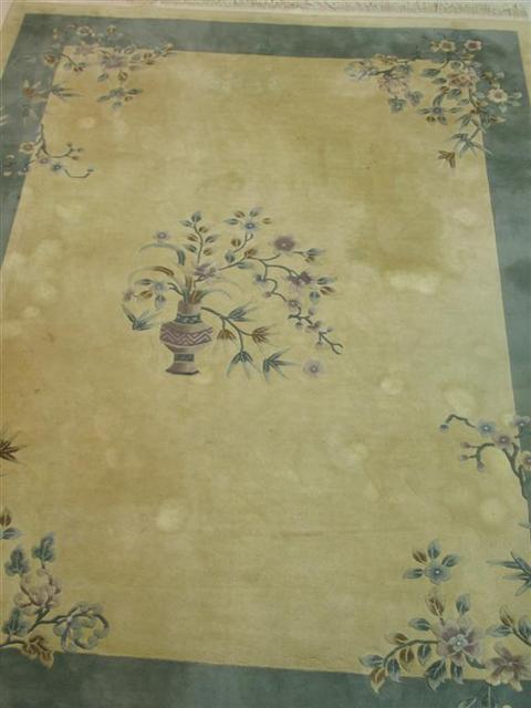 Appraisal: CHINESE NICHOLS STYLE RUG Blue-green design on beige ground