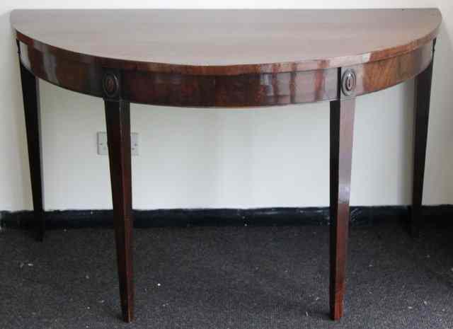 Appraisal: A George III mahogany semi-circular serving table circa on square