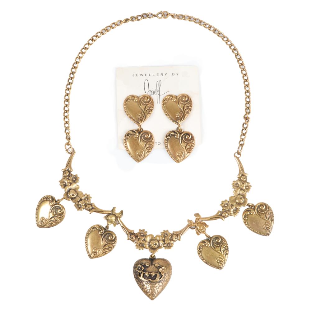 Appraisal: JOSEFF OF HOLLYWOOD REPOUSSE DANGLING HEART CHARM NECKLACE AND EARRING