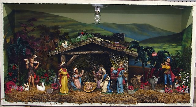 Appraisal: Diorama Creche Scene Resin figures Glass front electrified ' T