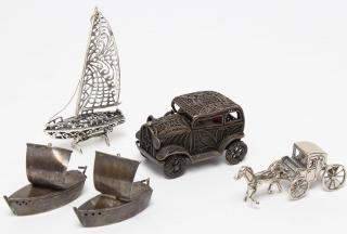 Appraisal: Silver Transportation Comprising a filigree sailboat pair of sailboat-form salt