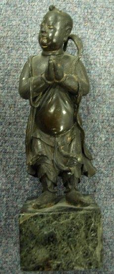 Appraisal: A th Century bronze figure of an immortal his hands