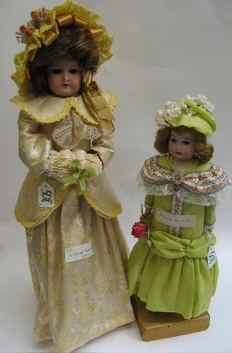 Appraisal: TWO BISQUE SHOULDER HEAD GIRL DOLLS One in mold brown