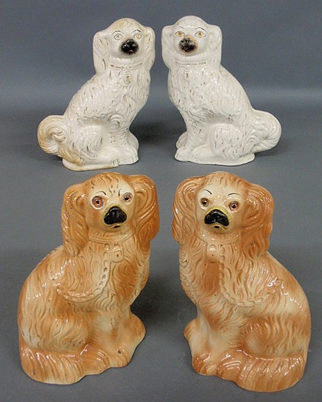 Appraisal: Pair of Staffordshire seated red Spaniels with glass eyes h