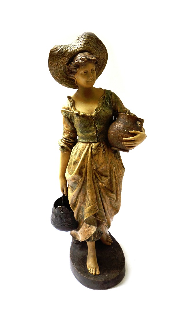 Appraisal: An Austrian terracotta figure of a young woman by the