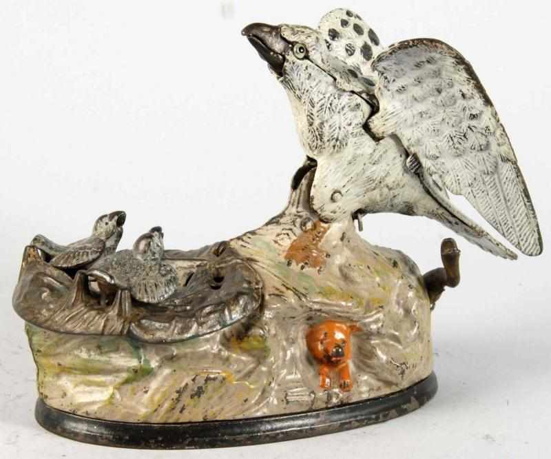 Appraisal: Cast Iron Eagle Eaglettes Mechanical Bank Description Manufactured by J