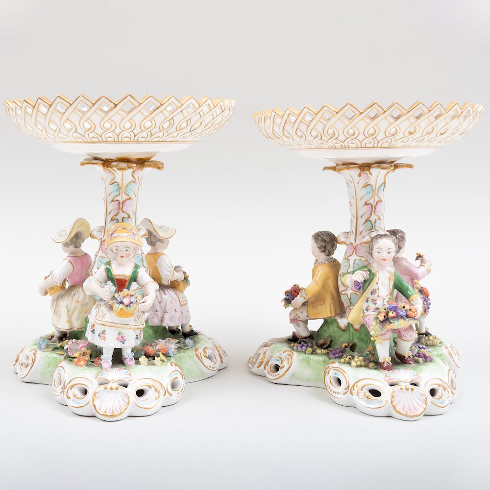 Appraisal: Pair of Stevenson Hancock Derby Porcelain Reticulated Figural Compotes Puce