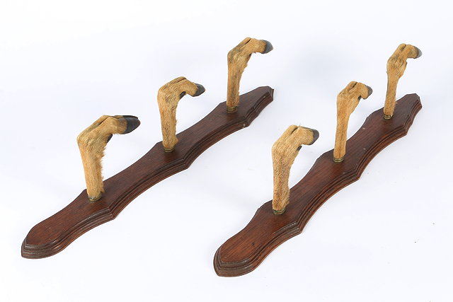 Appraisal: A PAIR OF THREE TIER DEER SLOTS mounted on oak