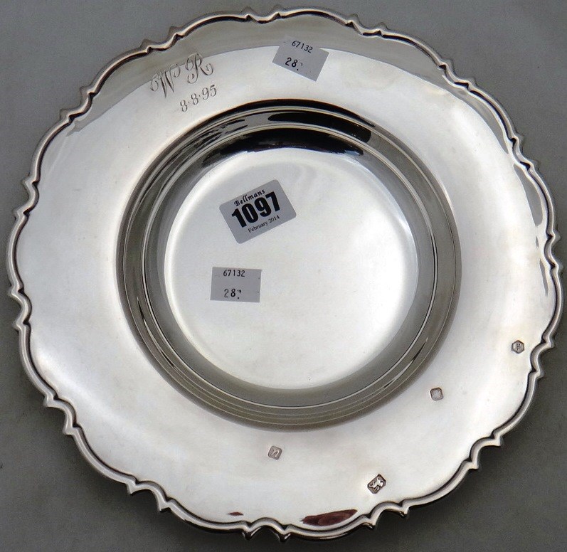 Appraisal: A modern silver shaped circular dish decorated with a scrolling