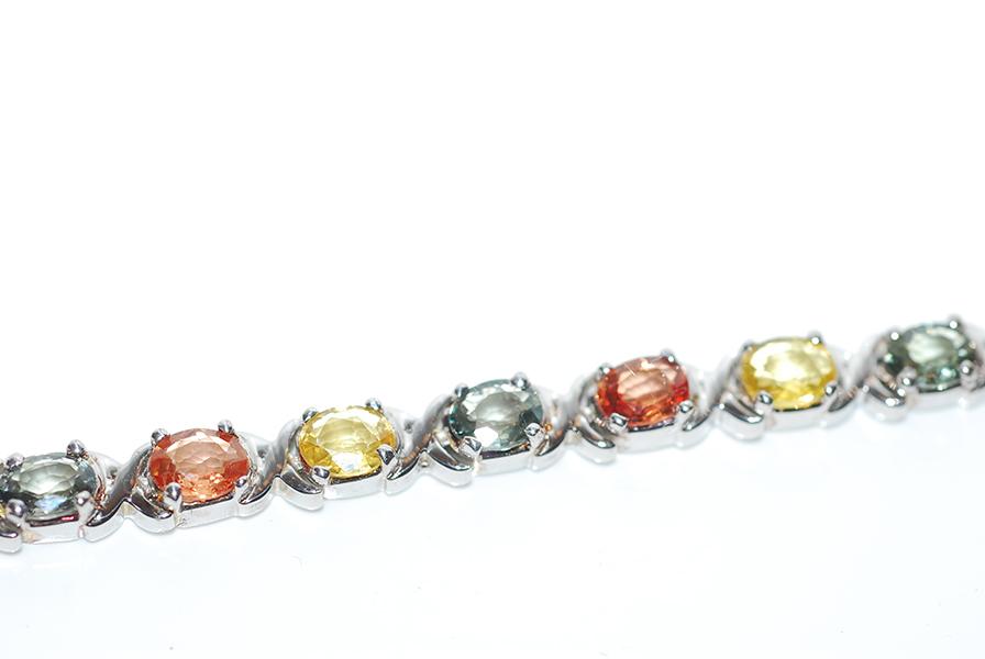 Appraisal: A MULTI COLOURED SAPPHIRE BRACELET IN STERLING SILVER A MULTI