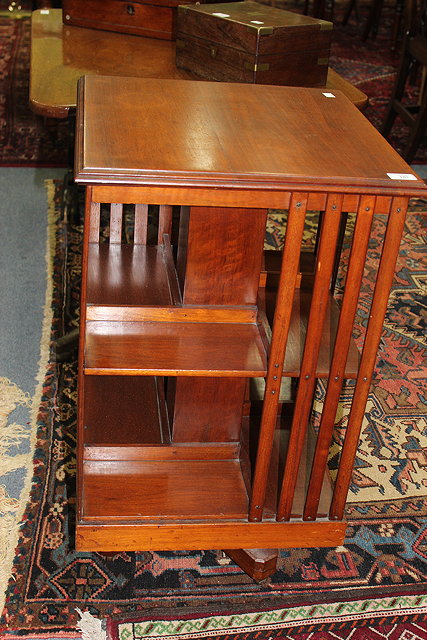 Appraisal: AN EARLY TH CENTURY MAHOGANY REVOLVING BOOKCASE with X framed