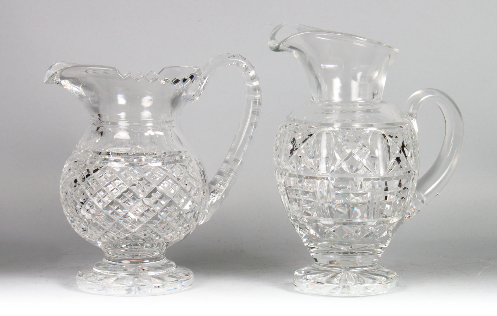 Appraisal: Two Waterford crystal footed pitchers and in H