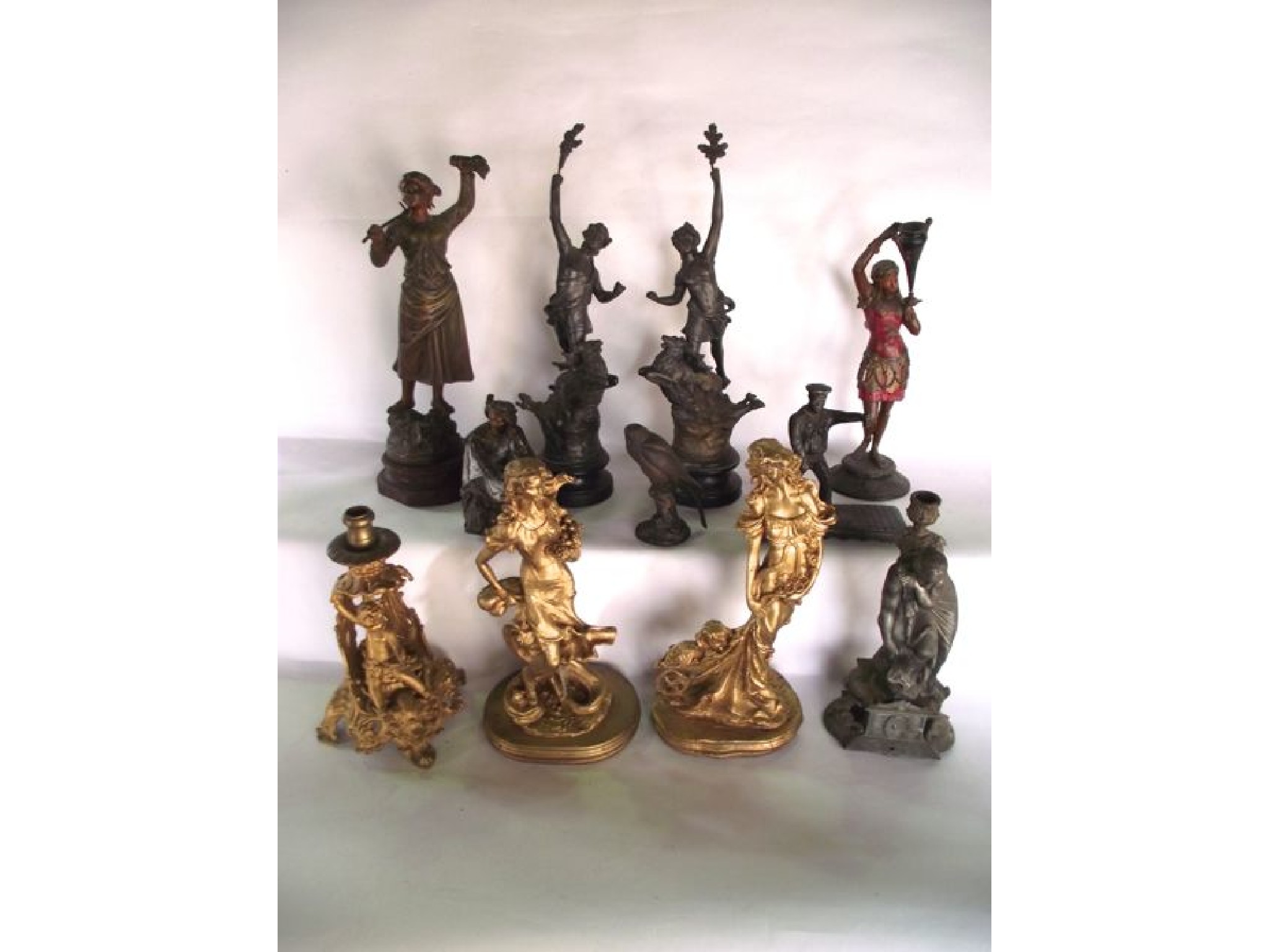 Appraisal: A group of spelter and cast metal figures to include