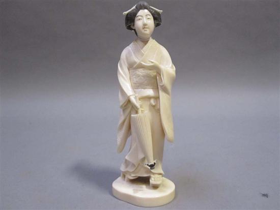 Appraisal: JAPANESE IVORY OKIMONO OF A GEISHA GIRL th C Holding