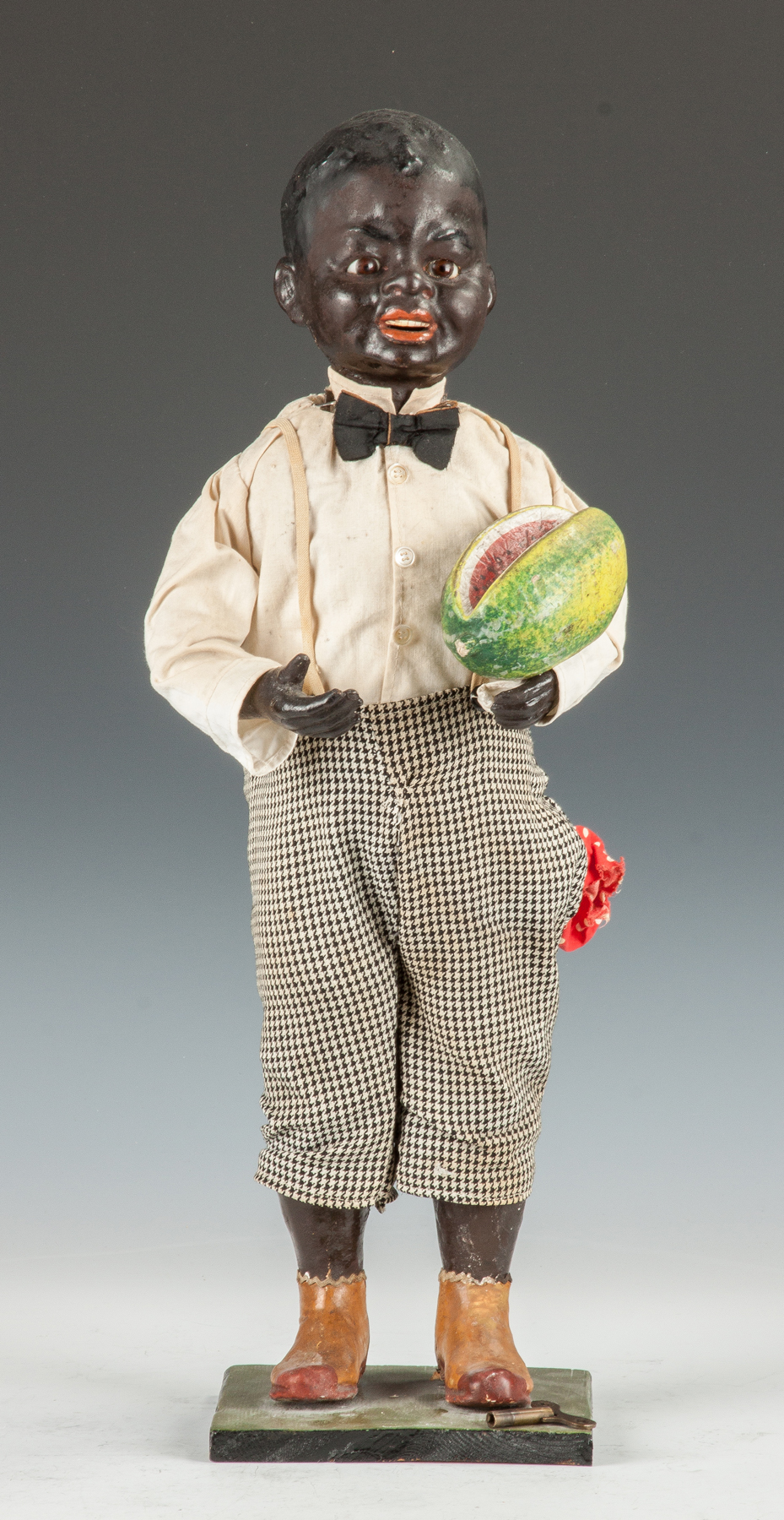 Appraisal: Black Boy with Watermelon Clockwork Store Display Early th cent