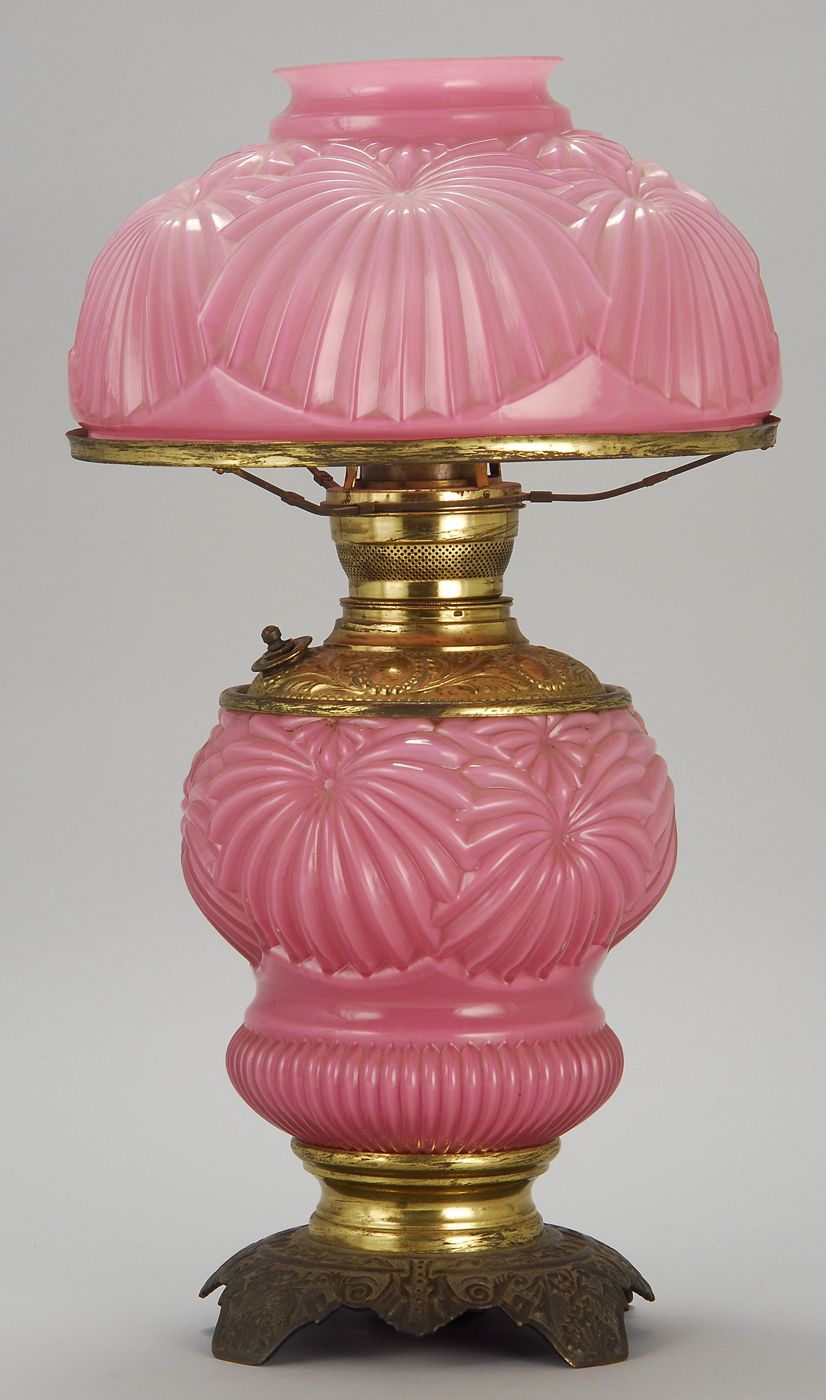 Appraisal: PINK CASED GLASS OIL LAMP Late th CenturyIn scallop shell