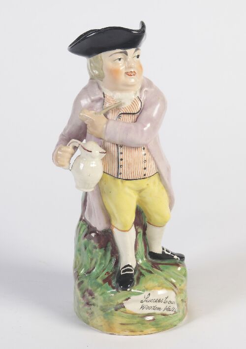 Appraisal: A th century Staffordshire Toby jug 'Success to our wooden