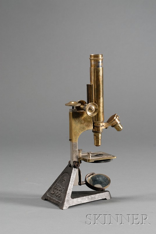 Appraisal: Brass Microscope by R J Beck London cast iron triangle