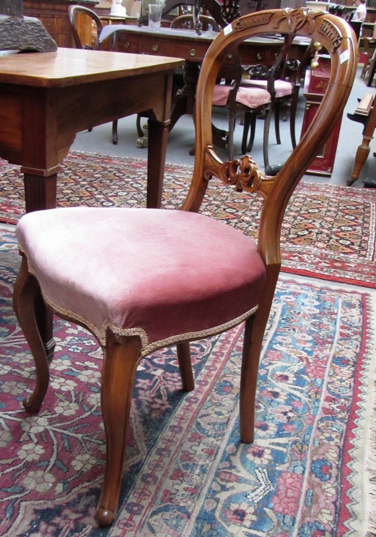 Appraisal: A set of six Victorian carved walnut balloon back dining