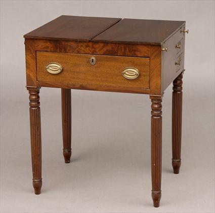 Appraisal: FEDERAL CARVED MAHOGANY DRESSING TABLE The top with hinged flaps