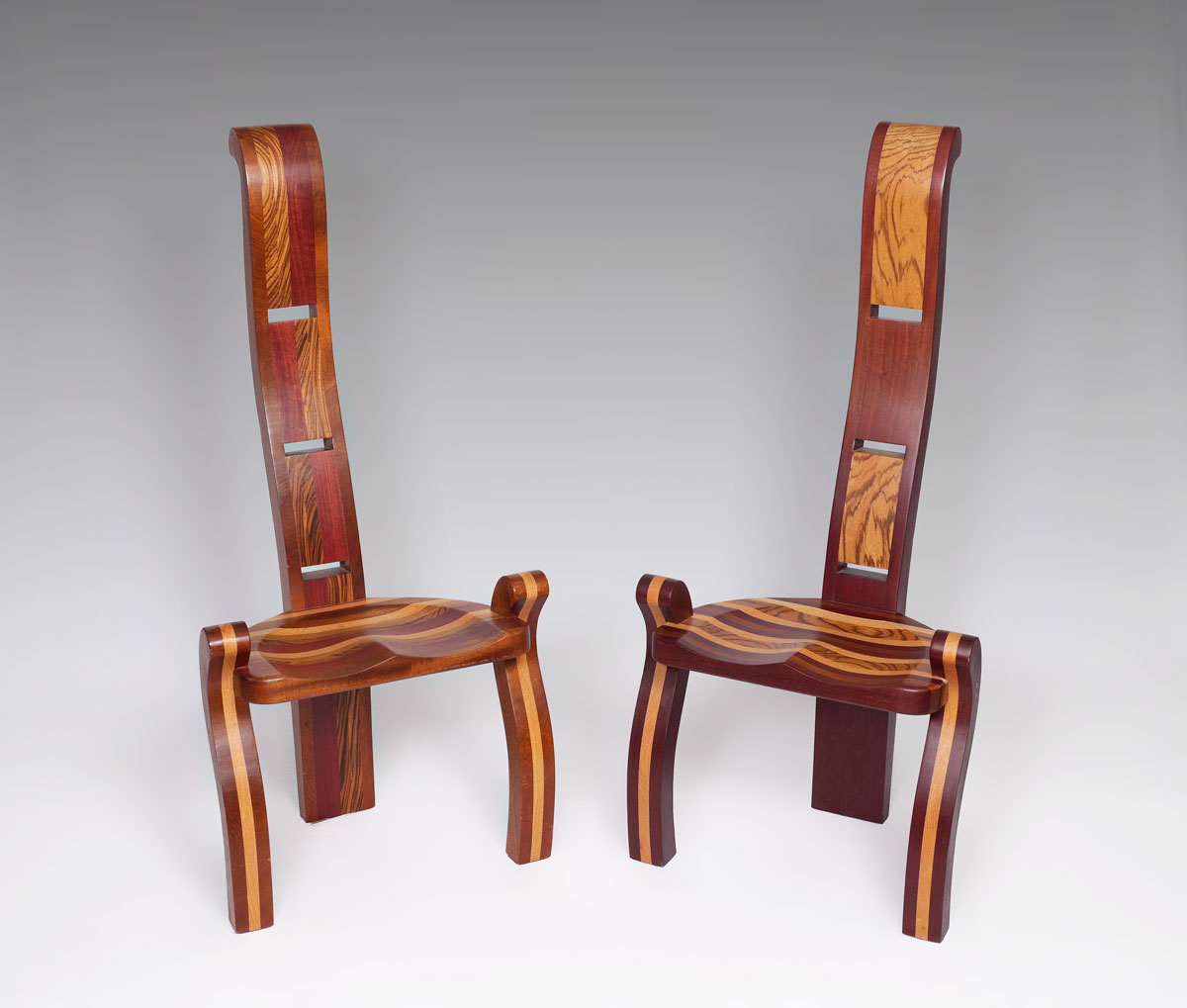 Appraisal: PAIR ALBERT ZIMMERMAN EXOTIC WOOD LEGGED CHAIRS Sculpted wood chairs