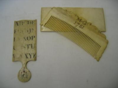 Appraisal: A GEORGE II IVORY COMB dated in case of shaped