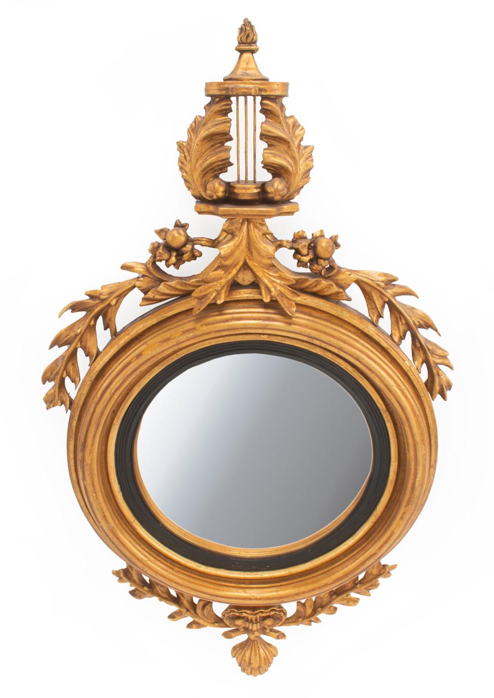 Appraisal: George III-Style Giltwood Convex Mirror pedimented foliate crest molded surround