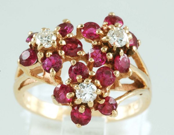 Appraisal: Ruby and diamond ring in marked K yellow gold Fifteen