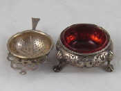 Appraisal: A Victorian embossed silver cauldron salt with cranberry glass liner