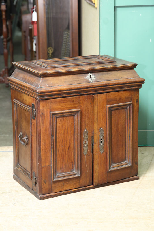 Appraisal: SMALL CABINET Walnut having a paneled lift top over two