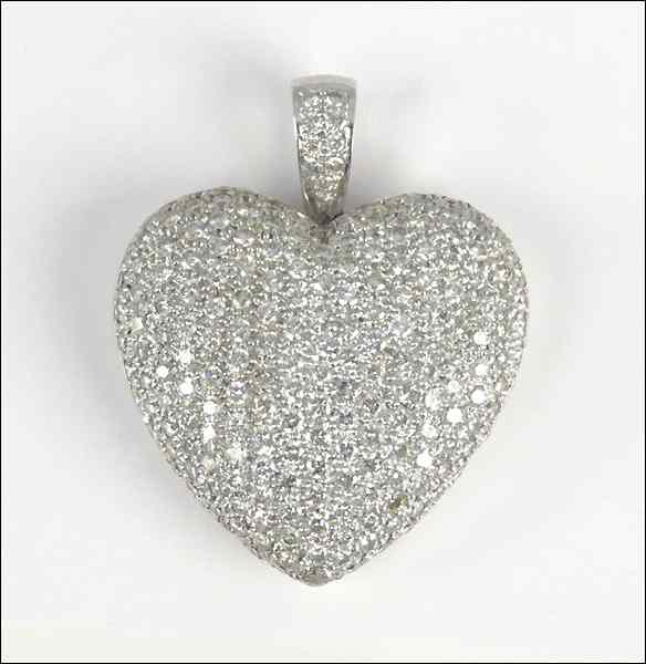 Appraisal: KARAT WHITE GOLD AND PAVE DIAMOND HEART PENDANT Diamonds are