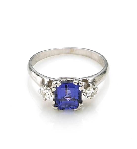 Appraisal: A tanzanite and diamond ring centering a square-cut tanzanite weighing